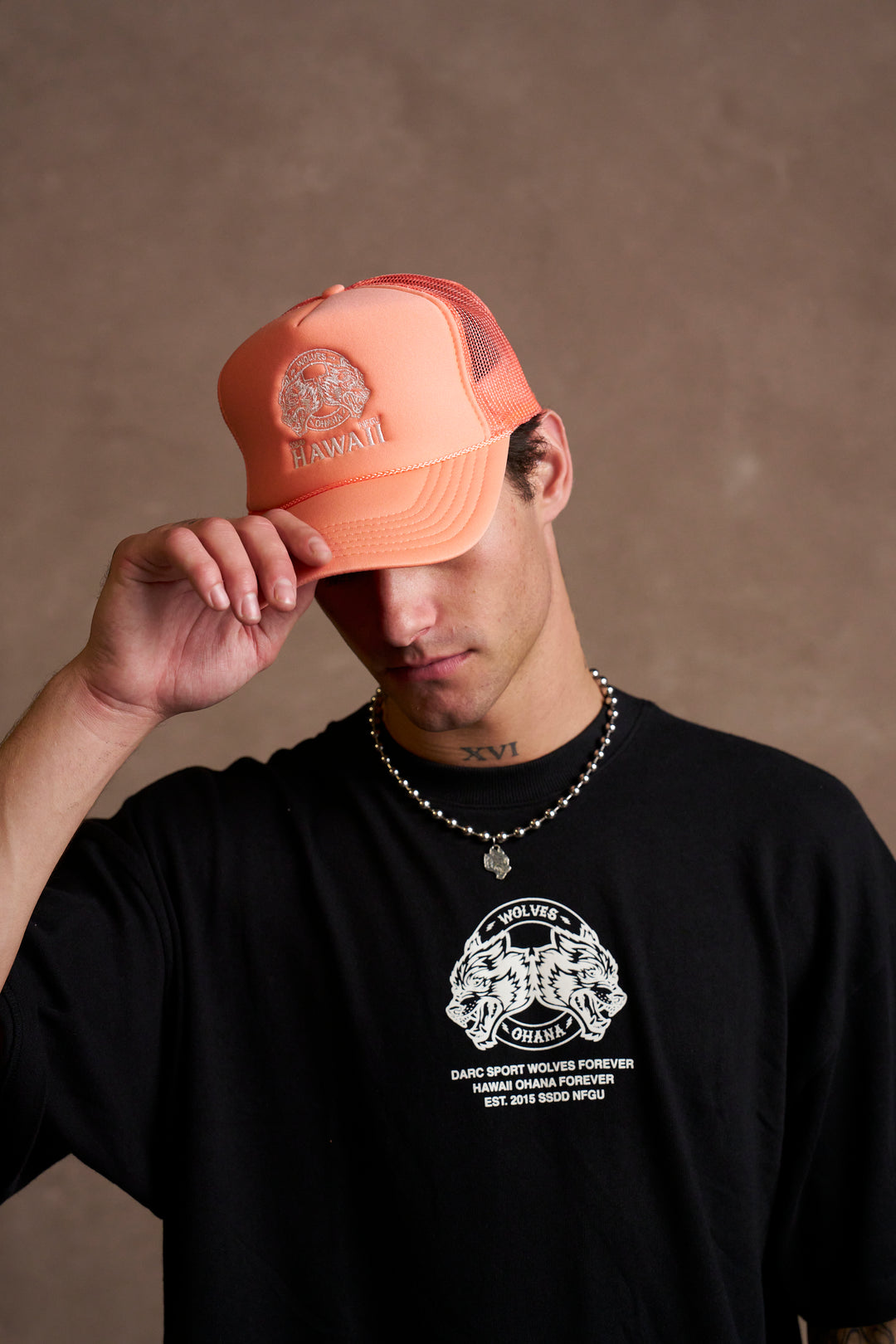 Wolves Ohana Trucker Hat in Neon Coral