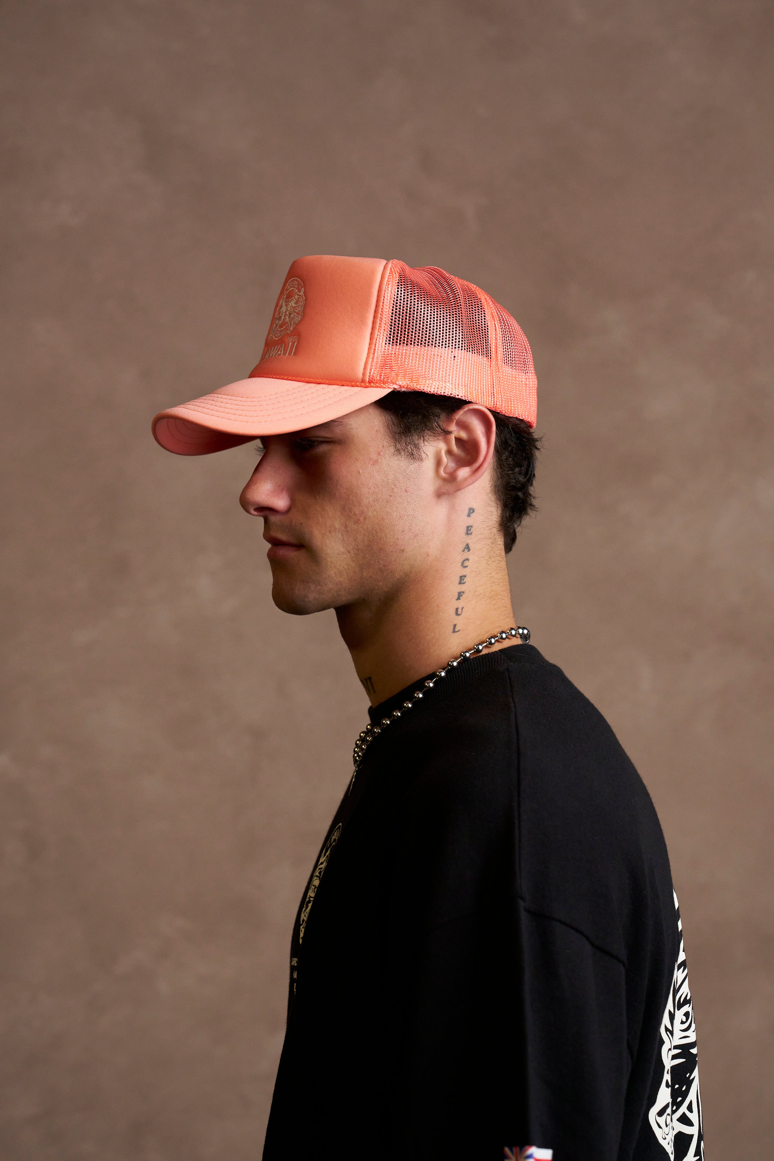 Wolves Ohana Trucker Hat in Neon Coral